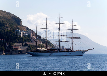 A lone pirate ship out on the blue seas Stock Photo