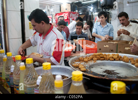 Kurdish customers at a falafel and shawarma restaurant in the bazaar district of the city of Erbil, in the Iraqi Kurdistan region of Northern Iraq. Stock Photo