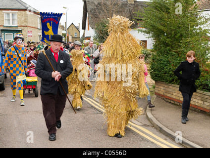 Whittlesea Straw Bear and keeper lead the parade at the Whittlesea Straw Bear Festival Stock Photo