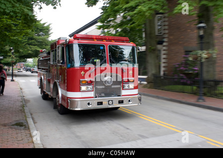 A fire engine speeding down the road. Intentional motion blur panning effect. Stock Photo