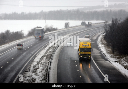 M11 motorway in snow on the Essex Cambridgeshire border Stock Photo