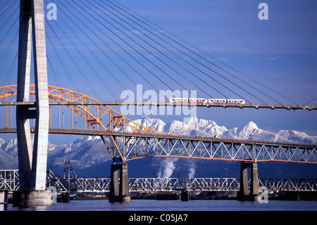 Bridges over Fraser River, New Westminster and Surrey, BC, British Columbia, Canada - Skytrain on SkyBridge, Pattullo Bridge Stock Photo