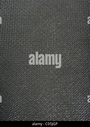 Raw carbon fiber material in its raw form prior to the clear epoxy finish. Stock Photo