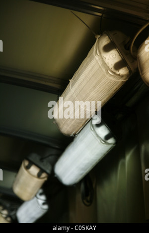 row of fluorescent strip lights on wall in dark tent room Stock Photo