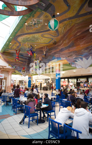 Shoppers in Albuquerque, New Mexico eating lunch inside of a shopping mall foodcourt. Stock Photo
