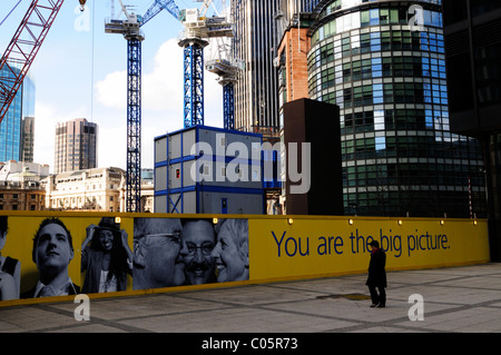 Construction Cranes on The London Pinnacle building site from in front of the Aviva building, Leadenhall Street, London, England Stock Photo