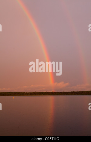 Rainbow over a lake in the Northwoods of Wisconsin. Stock Photo