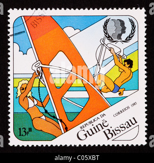 Postage stamp from Guinea Bissau depicting windboarders. Stock Photo