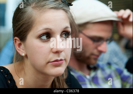A young man and a young woman looking a bit bored, Germany, Europe Stock Photo