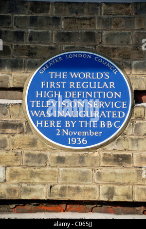 Blue plaque outside Alexandra Palace commemorating the inauguration of the World's first regular television service in 1936. Stock Photo