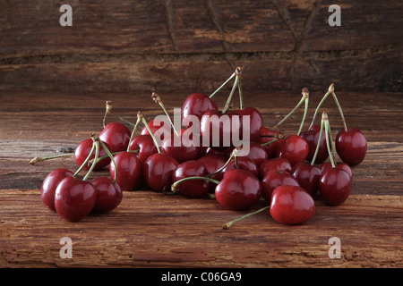 Cherries on rustic wood Stock Photo
