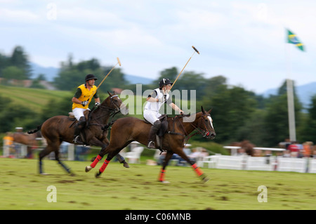 Polo players battling for the ball, Max Bosch from Team Porsche, front, being pursued by Miguel Amiva from Team Koenig & Cie Stock Photo