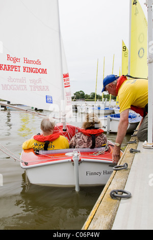Sail dinghy modified for disabled people launches at Oulton Broad - courtesy of the Waveney Sailability Trust Stock Photo
