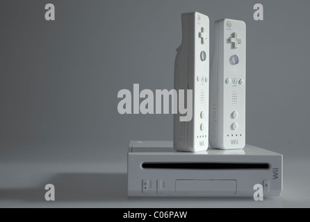 Selective focus shot of a Nintendo Wii video game console with two Wiimote wireless controllers Stock Photo