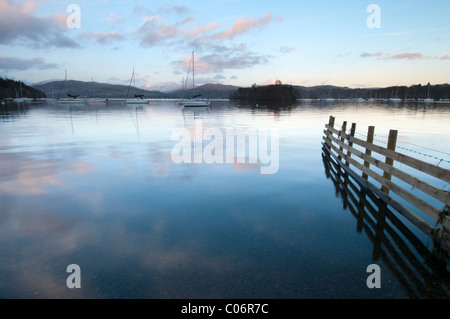 Evening light on a tranquil Lake Windermere in the Lake District, Cumbria England Stock Photo