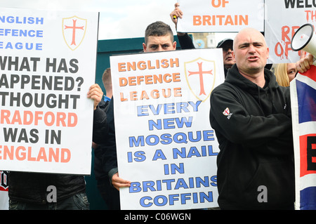 EDL supporters hold banners and sing England songs Stock Photo