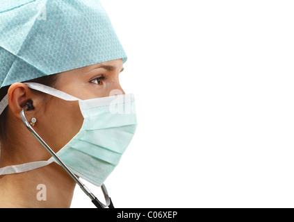 Profile of a female doctor with mask and stethoscope isolated against a white background.white background Stock Photo