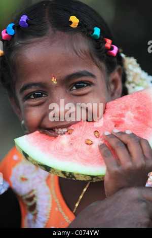 Indian girl eating a slice watermelon Andhra Pradesh South India Stock ...