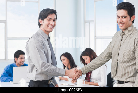 Two businessmen shaking hands Stock Photo