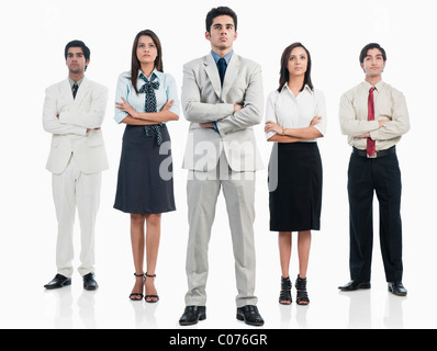 Business executives standing with arms crossed Stock Photo