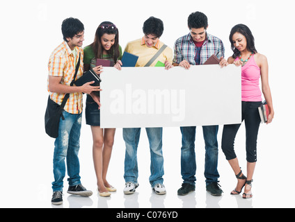 College students holding a blank placard Stock Photo - Alamy