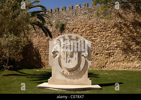 Coat of arms of Lagos in front of the city wall in Lagos, Algarve, Portugal, Europe Stock Photo