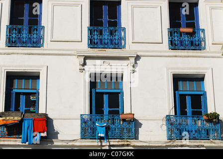 Algeria, Algiers, clothes hanging on clothesline for drying in the balcony of residential building Stock Photo