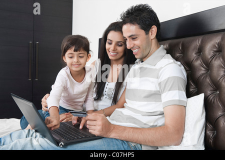 Man doing online shopping with his family Stock Photo