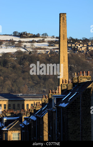 Rows of terraced houses lead to the mill chimney of Salts Mill, in the world heritage site of Saltaire, near Bradford, Yorkshire Stock Photo