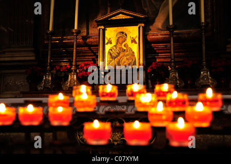 Candles in front of an icon of Our Lady in Salzburg Cathedral, Salzburg, Salzburg, Austria, Europe Stock Photo