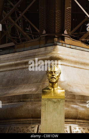Bust of Gustave Eiffel near a tower, Eiffel Tower, Paris, France Stock Photo