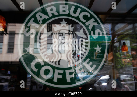 New Starbucks Logo reflected in a shop window, Seattle, Washington, USA Stock Photo