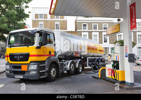 Tanker supplying Fuel station. Stock Photo