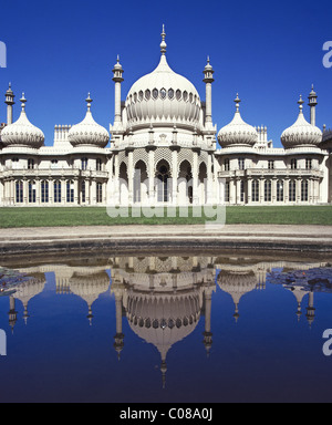 Facade of Brighton Pavilion or Royal Pavilion former royal residence domes & minarets added by John Nash & reflected in water East Sussex England UK Stock Photo