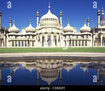 Facade of Brighton Pavilion or Royal Pavilion former royal residence domes & minarets added by John Nash & reflected in water East Sussex England UK Stock Photo