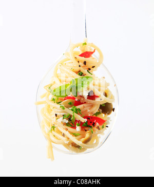 Spoon of pasta salad sprinkled with Parmesan Stock Photo