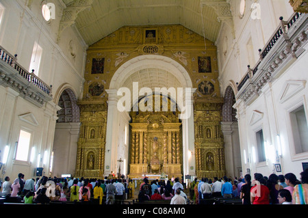 India, Goa, Old Goa. Portuguese basilica of Bom Jesus, the most famous church in Old Goa. Sunday church service. Stock Photo