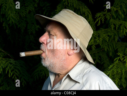 Cigar smoker with a hat Stock Photo