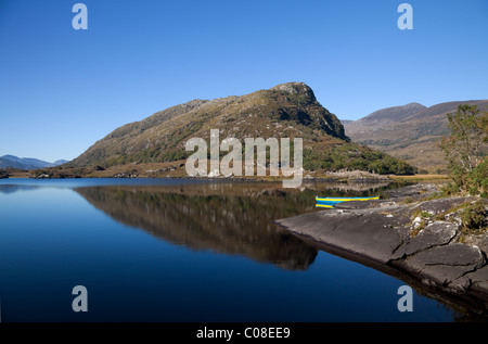 Eagle's Nest Mountain & Brightly Coloured Rowing Boat, The Long Range, Killarney National Park, County Kerry, Ireland Stock Photo