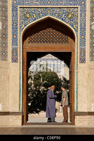 Uzbeki men in the entranceway of the Kalon Mosque, Bukhara, Uzbekistan Stock Photo