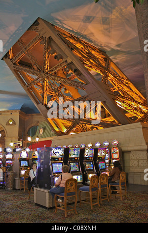 Slot machines at the Paris Las Vegas casino, under a leg of the Eiffel  Tower replica Stock Photo - Alamy