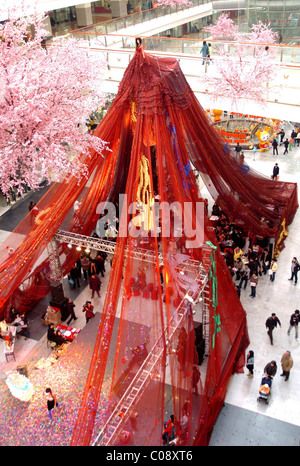 GIANT WEDDING GOWN TAKES FLIGHT  Spanning a massive 999 metres, this wedding dress is wowing visitors to a department store in Stock Photo