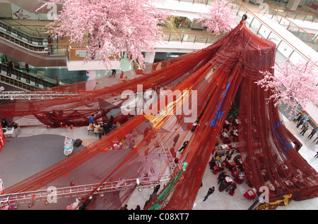 GIANT WEDDING GOWN TAKES FLIGHT  Spanning a massive 999 metres, this wedding dress is wowing visitors to a department store in Stock Photo