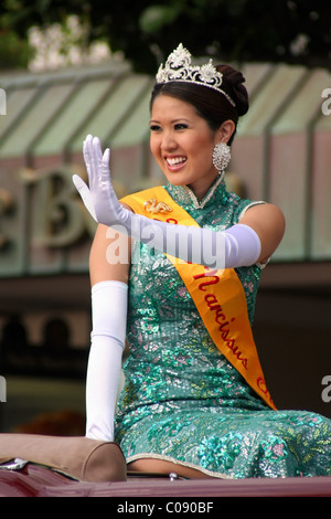 Honolulu Hawaii's Narcissus Queen is riding in a car waving to spectators at the Honolulu Festival parade in Honolulu, Hawaii. Stock Photo