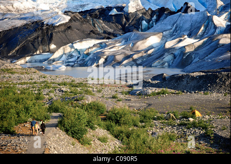 View overlooking hikers walking along trail to Spencer Glacier, Chugach National Forest, Kenai Peninsula, Southcentral Alaska Stock Photo