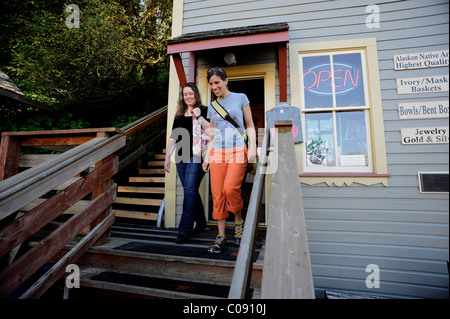 Two women shop along Creek Street in Ketchikan, Southeast Alaska, Summer Stock Photo