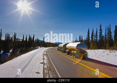 Semi-truck hauling tankers on the George close to the Denali National Park and Preserve entrance, Alaska Stock Photo