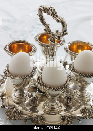 Antique silver egg cups in a sophisticated environment Stock Photo