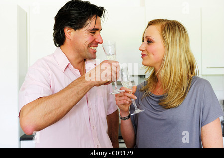 Young couple clinking glasses with champagne Stock Photo