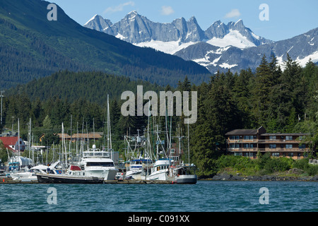 Commercial fishing vessels docked in Auke Bay with Mendenhall Towers in the distance, Juneau, Tongass National Forest, Alaska Stock Photo